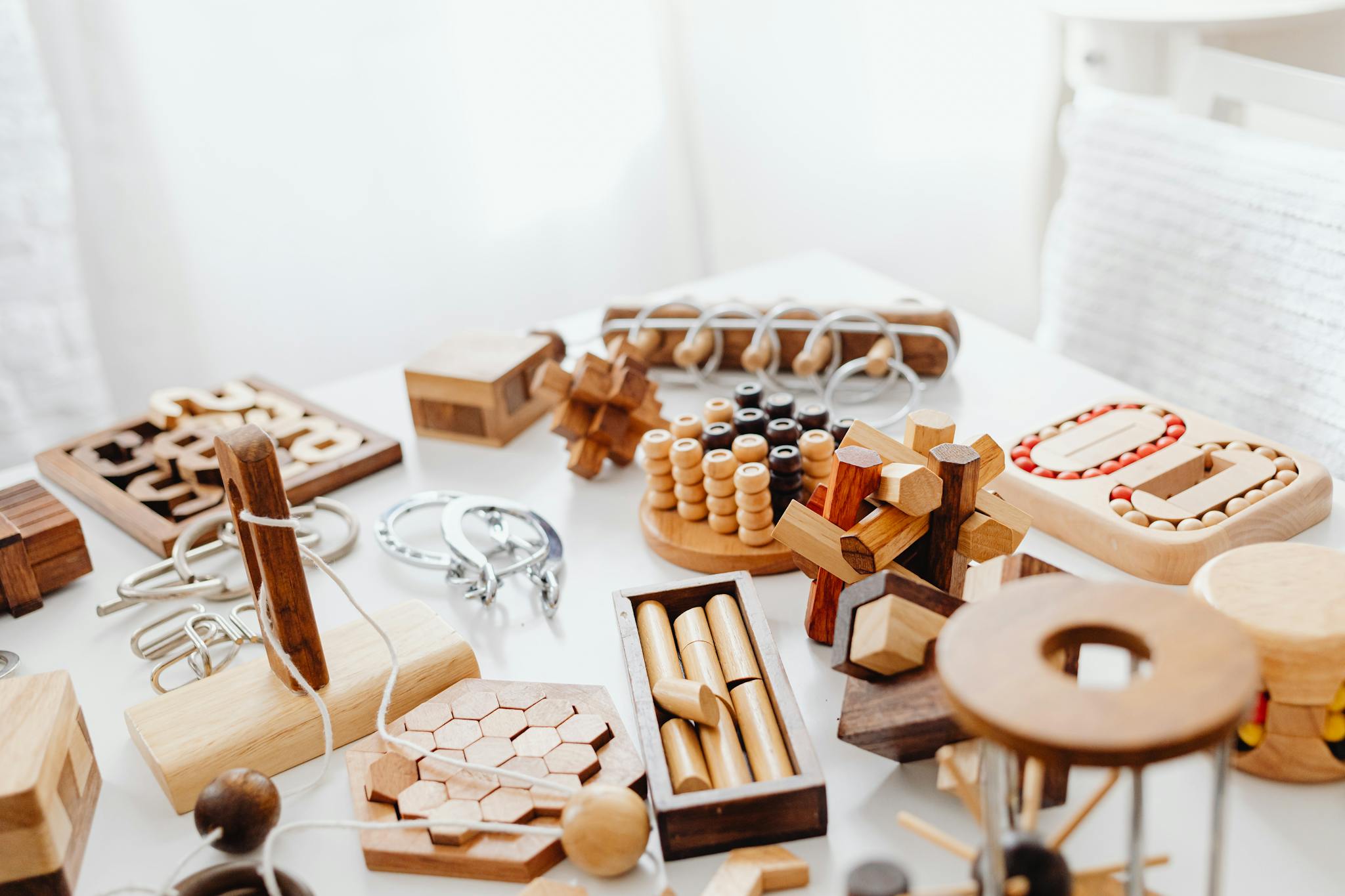 A variety of handcrafted wooden puzzles showing material and finish quality for sample review.