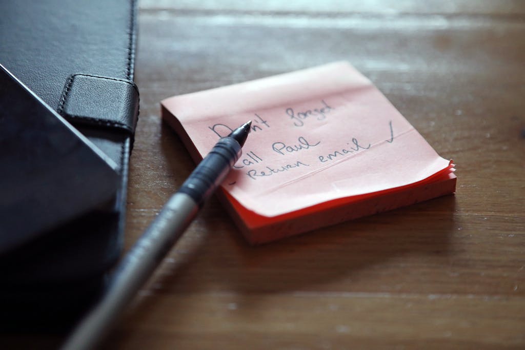 Notes and pen on a desk representing the brief and specification process.